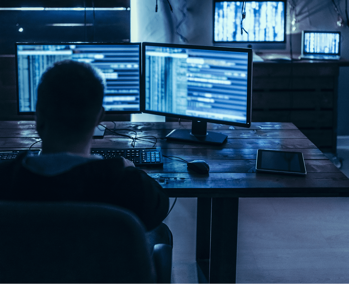 Programmer working in a dimly lit room